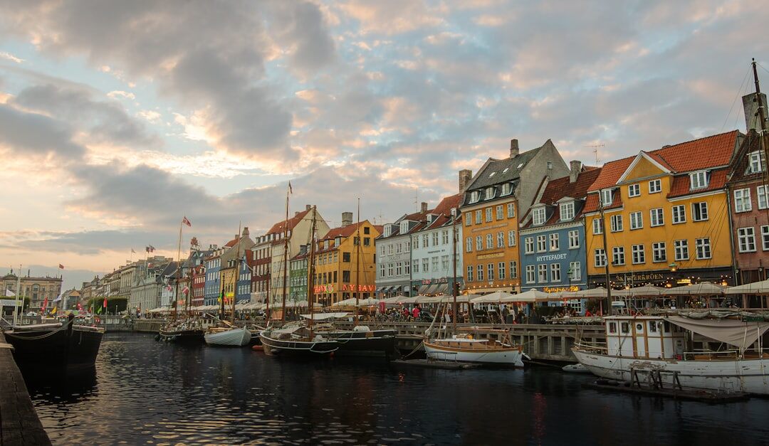 Small Danish fishing harbor at dusk with boats