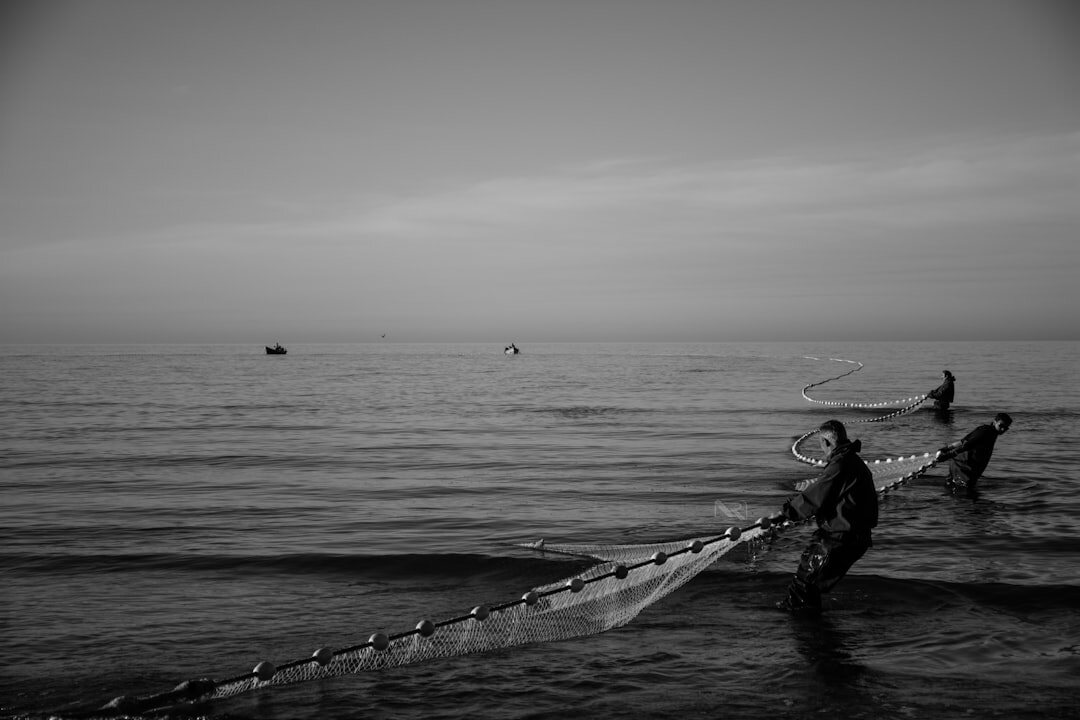 fisherman hauling nets